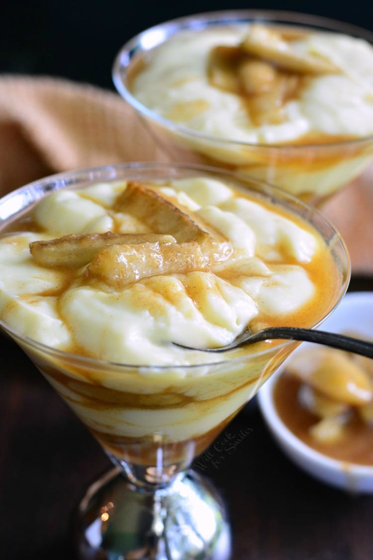 Bananas Foster Pudding Parfait in a martini glass with a spoon in it. 