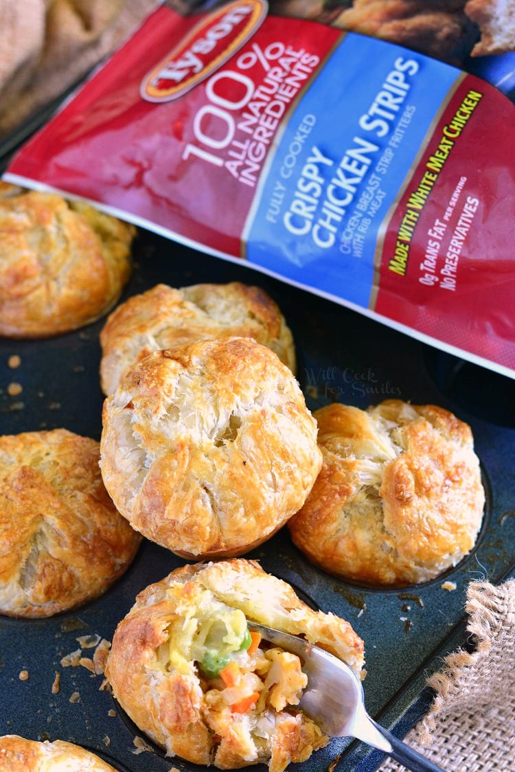 Chicken Pot Pie Pockets in a muffin pan and a bag of tyson chicken strips in the background 