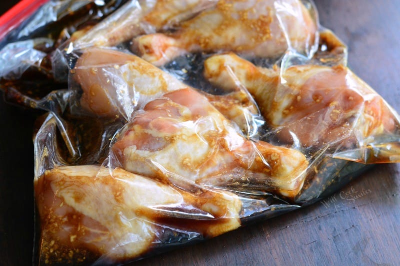 Chicken Drumsticks in a ziplock bag with sweet garlic marinade on a table 