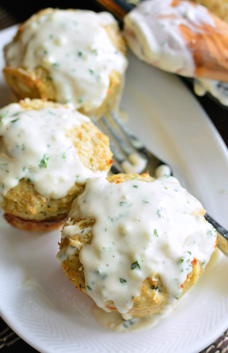 top view of Garlic Parmesan Chicken Mini Meatloaves on a plate with a fork 