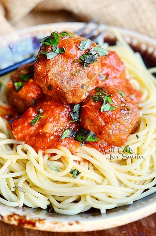 spaghetti and meatballs on a plate 