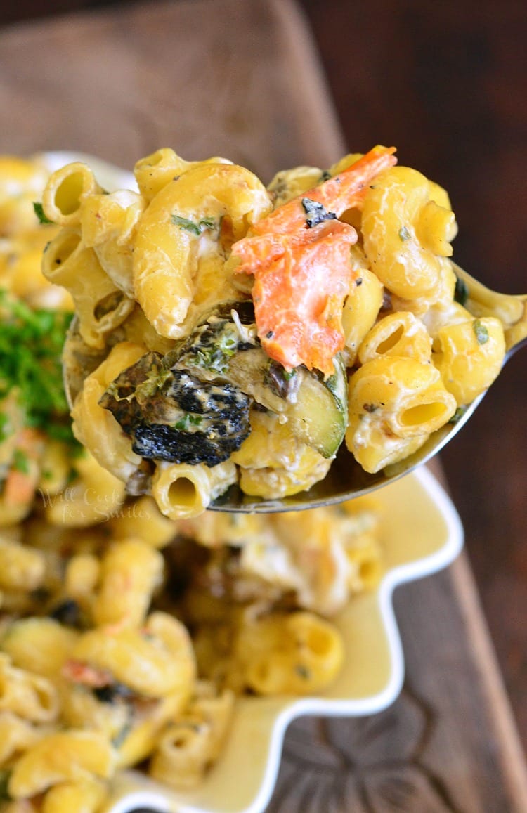 Grilled Vegetable Pasta Salad on spoon being scooped out of bowl 