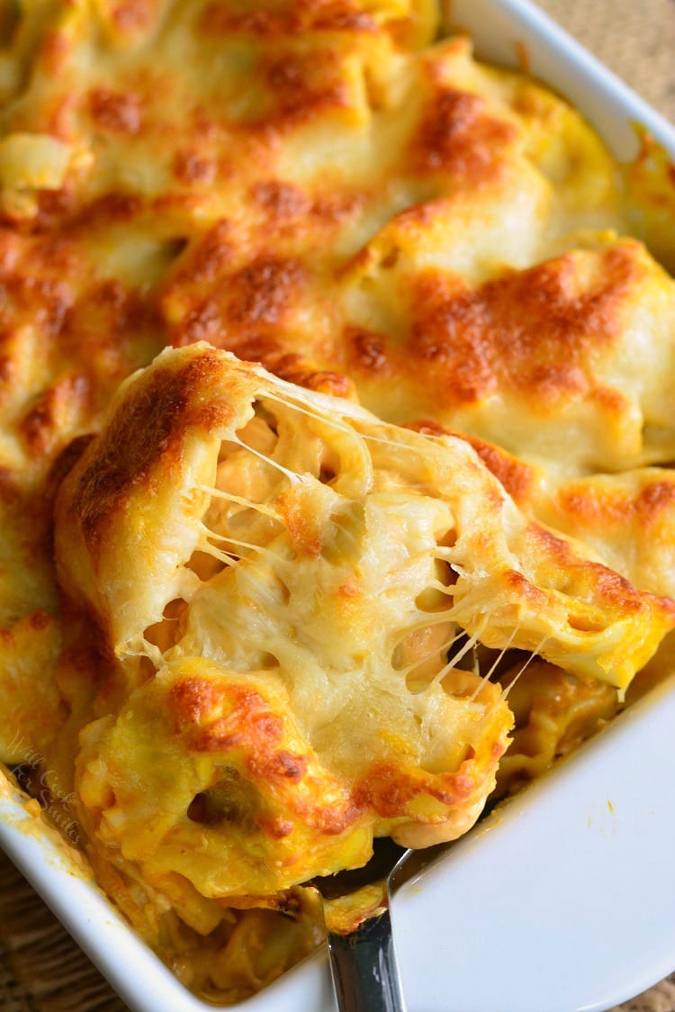 Spicy Three Cheese Pumpkin Tortellini Bake in a white casserole dish 