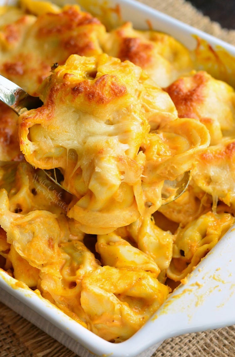 Spicy Three Cheese Pumpkin Tortellini Bake in a white baking dish 