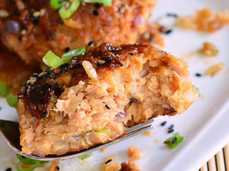 cut salmon and rice patty on a fork