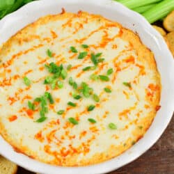 closeup of baked buffalo dip in the white dish.