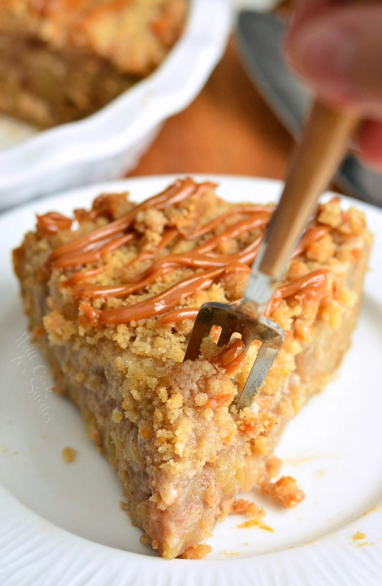 Caramel Apple Cookie Crust Pie on a white plate with a fork on the top 