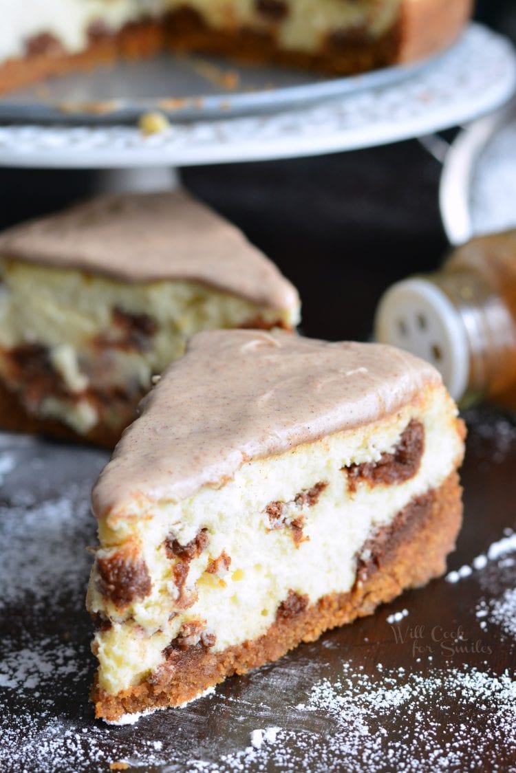 Cinnamon Roll Cheesecake slices on a cutting board 