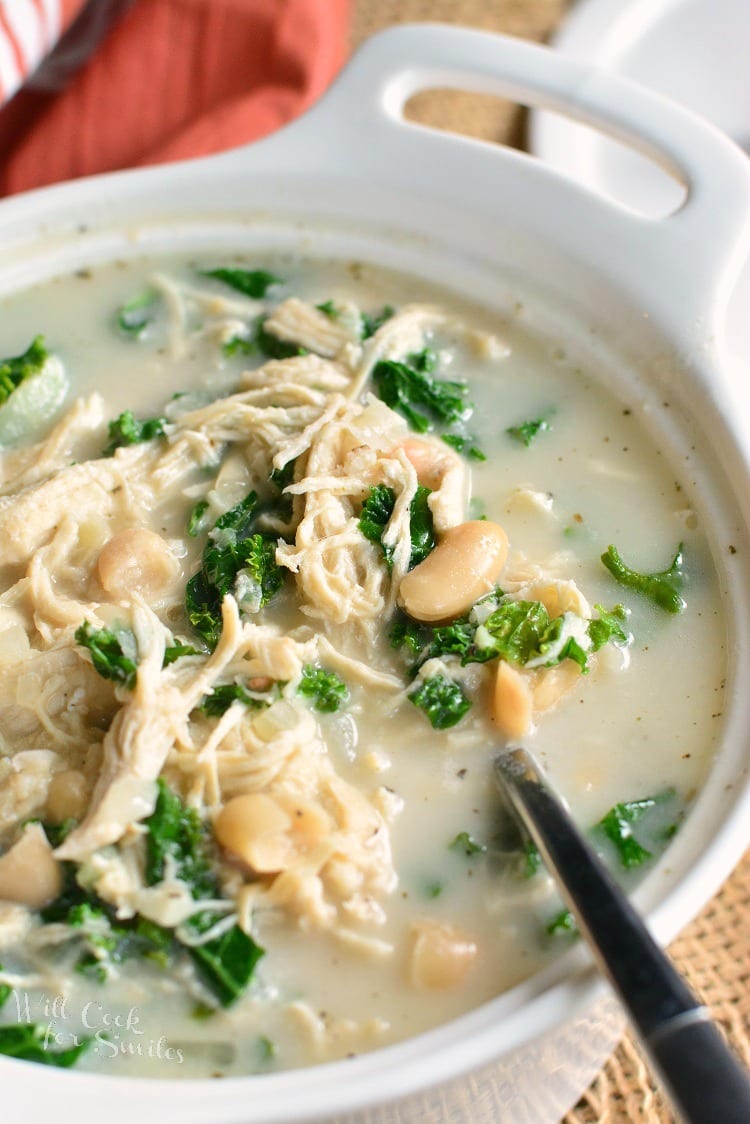 Creamy Chicken and Bean Soup. This creamy soup is actually light and made with shredded chicken breast, two types of beans, and kale. #chickensoup #soup