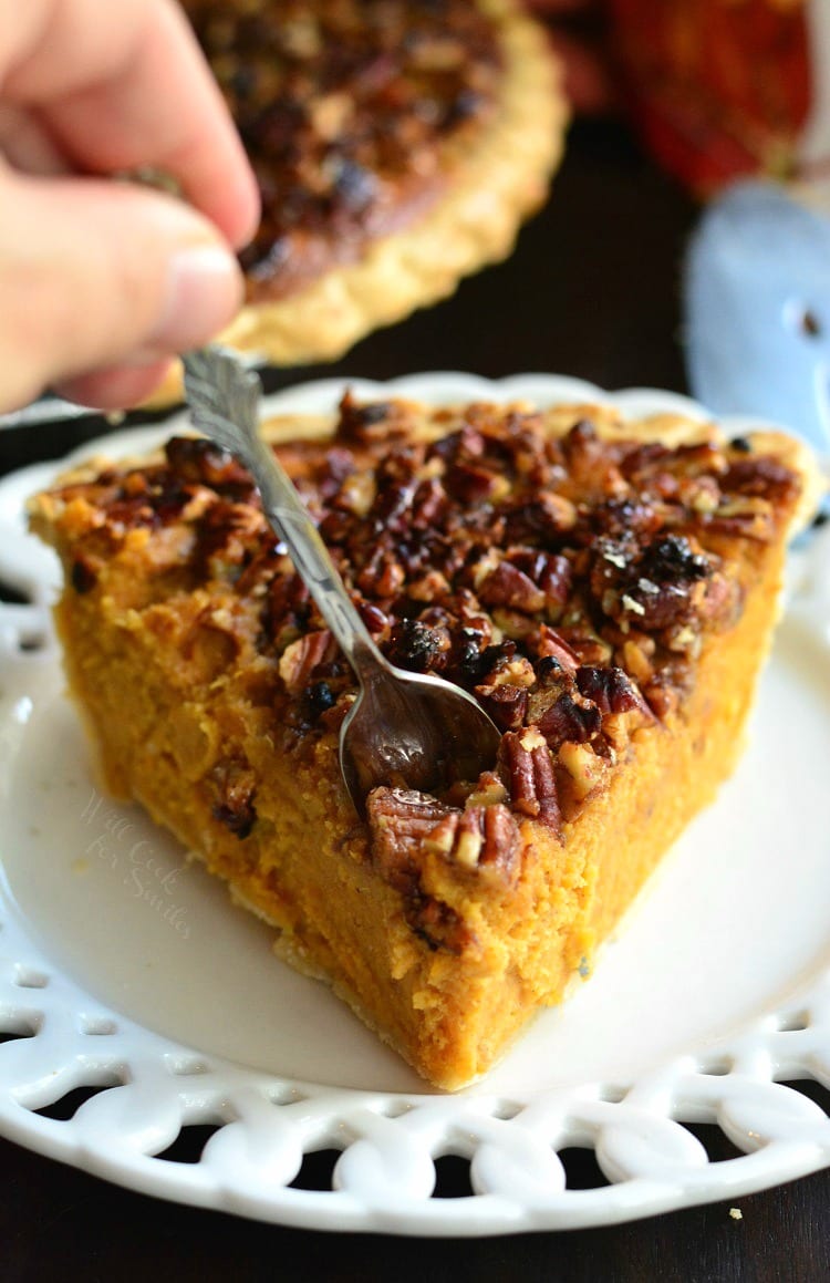 Pecan Crunch Sweet Potato Pie on a plate with me putting the fork in it 