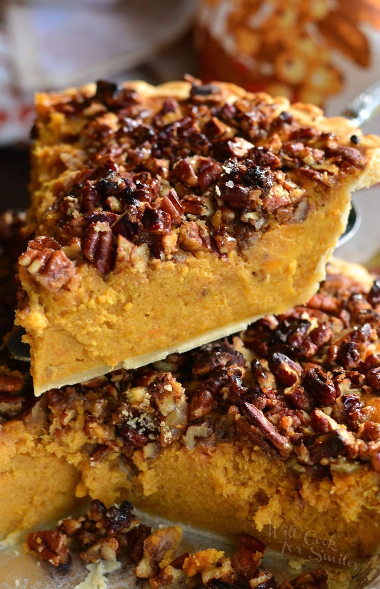 Pecan Crunch Sweet Potato Pie being lifted out of the pie pan 