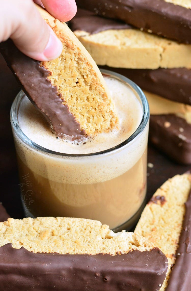 dipping Dark Chocolate Cappuccino Biscotti in espresso 