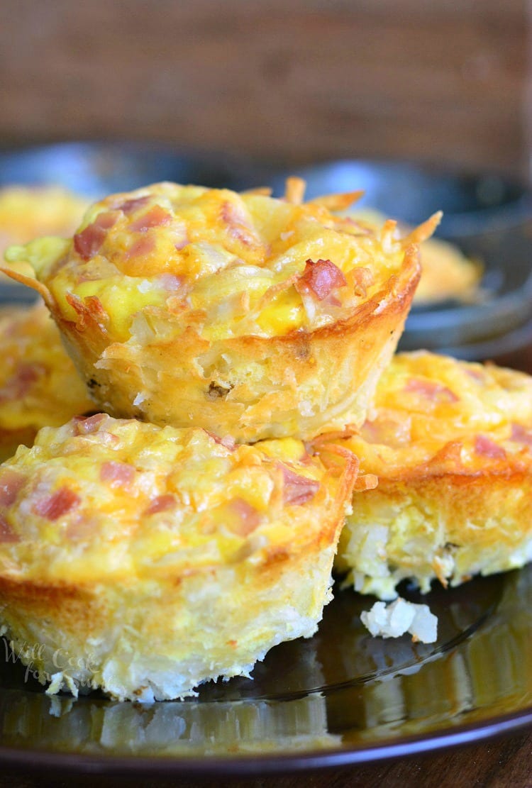 Ham Egg and Cheese Hash Brown Breakfast Muffins stacked on a plate 