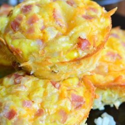 ham and cheese egg hashbrown muffins in on top on a cookie sheet.