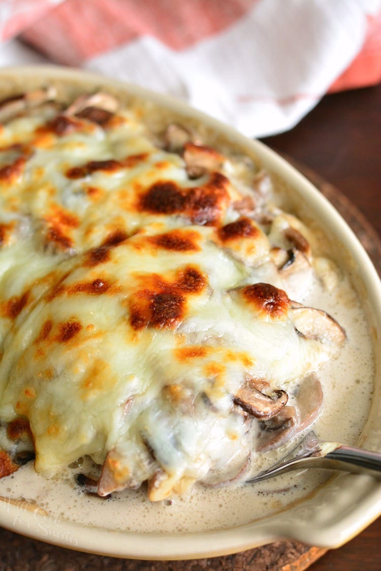 Creamy Russian Mushroom Julienne in casserole dish with a spoon 