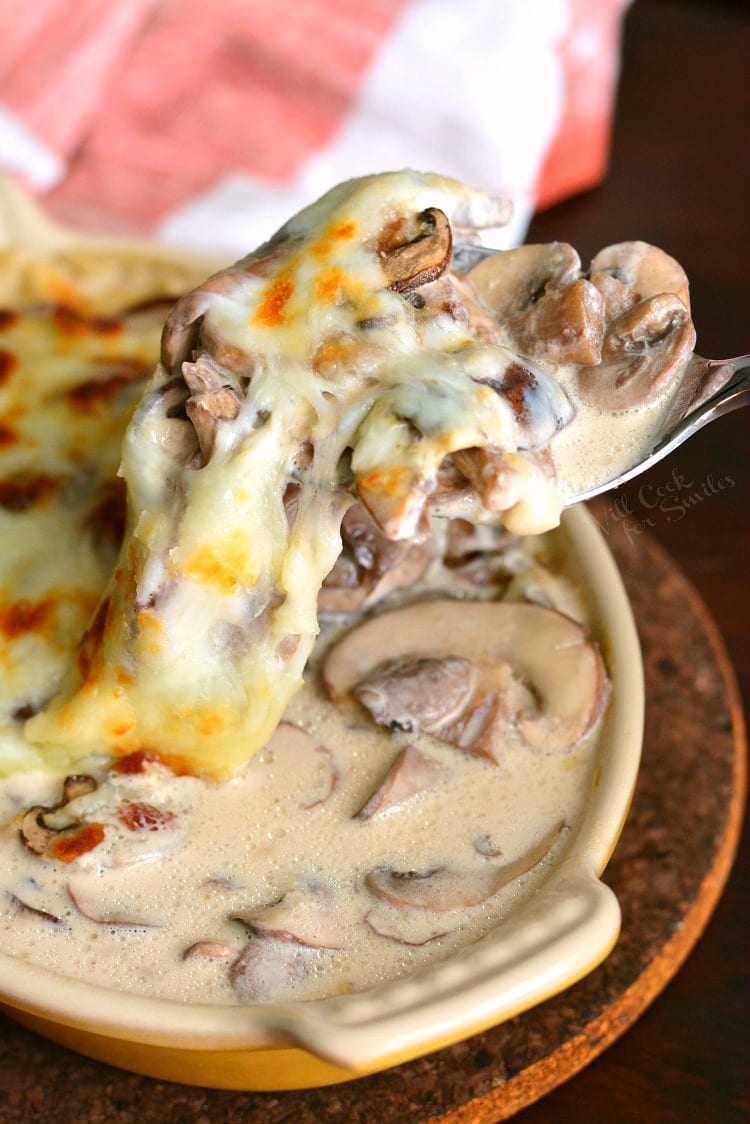 Creamy Russian Mushroom Julienne in casserole dish with spoon scooping some out 