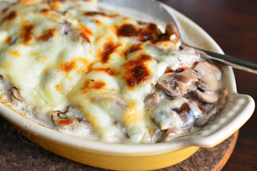 Creamy Russian Mushroom Julienne in casserole dish with a spoon 