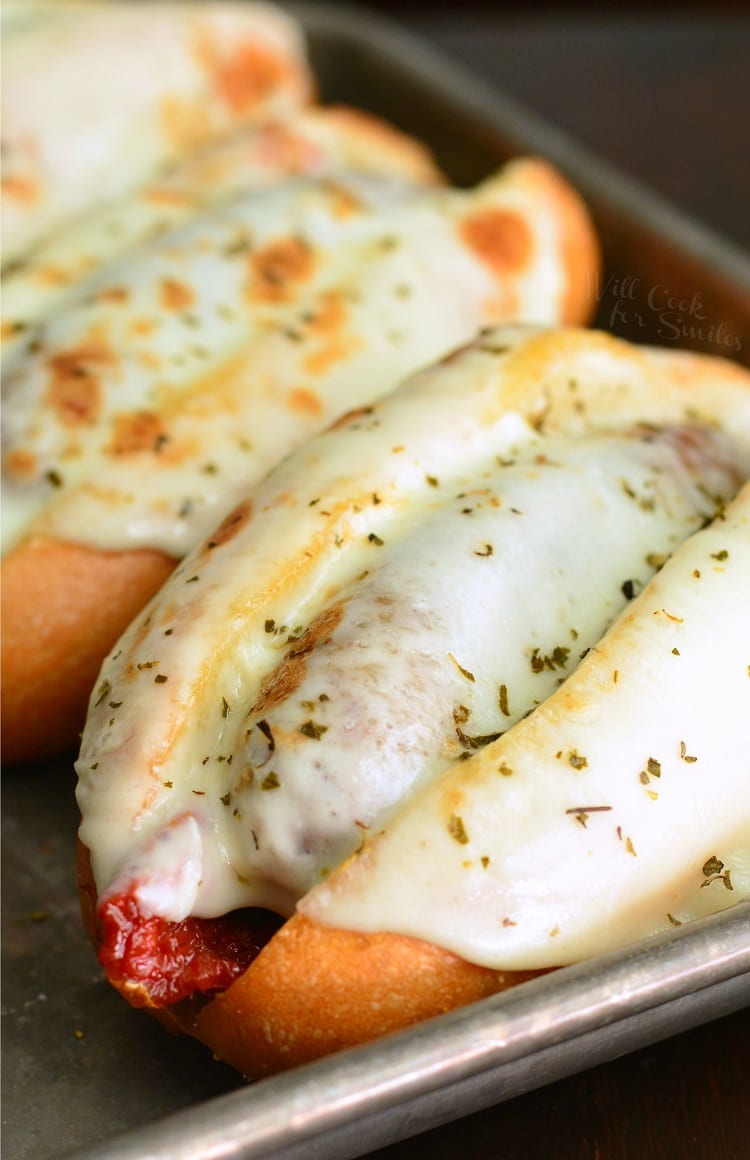 Tomato Mozzarella Italian Sausage Hoagies on a baking sheet 