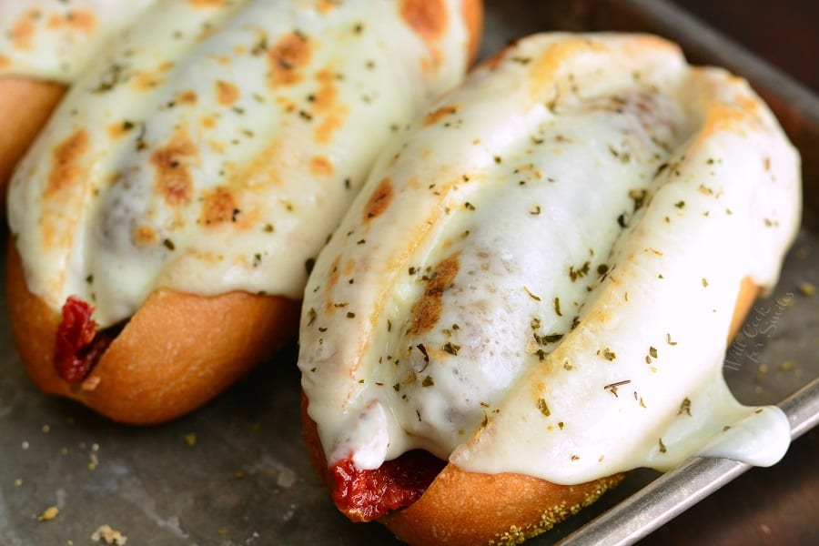 Tomato Mozzarella Italian Sausage Hoagies on a baking sheet 