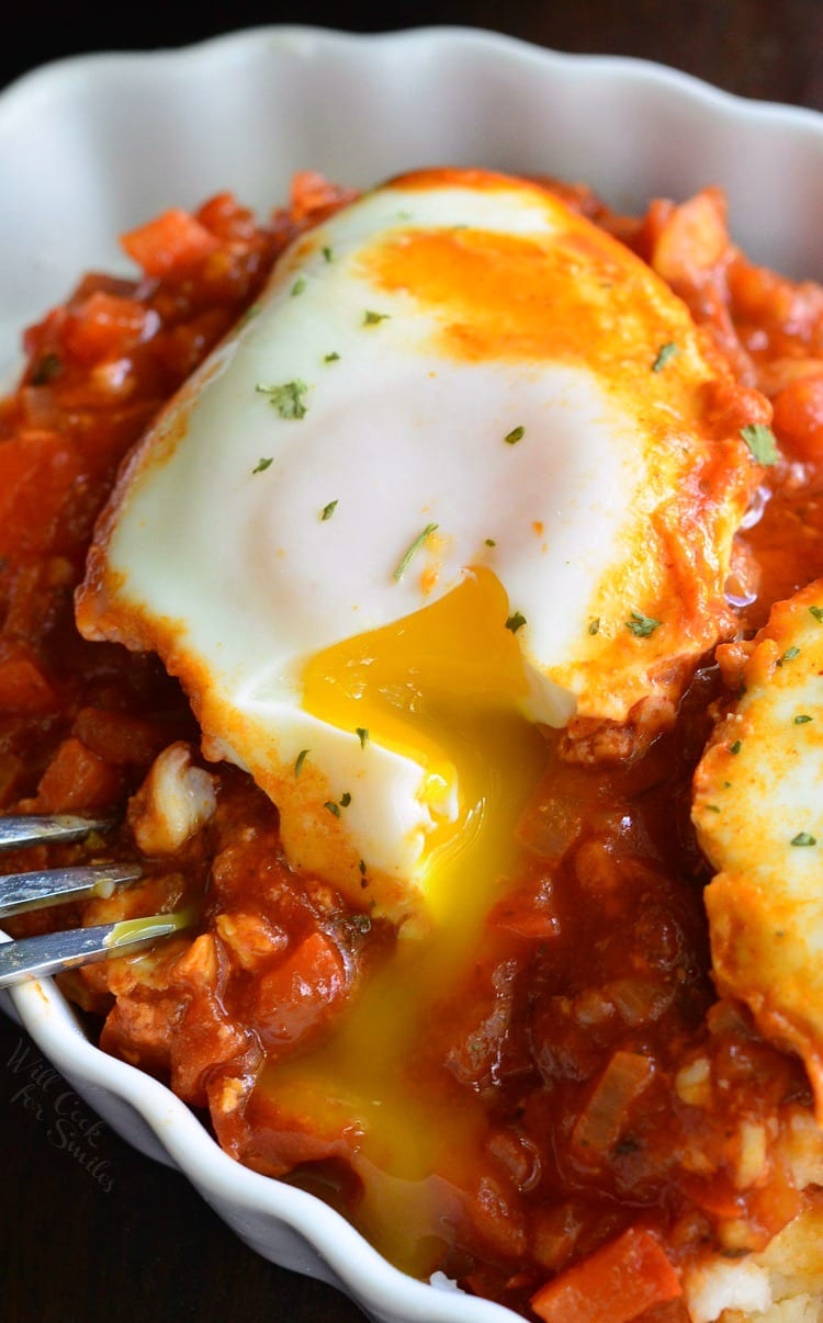 Shakshuka with Parmesan Polenta in a bowl with a fork 