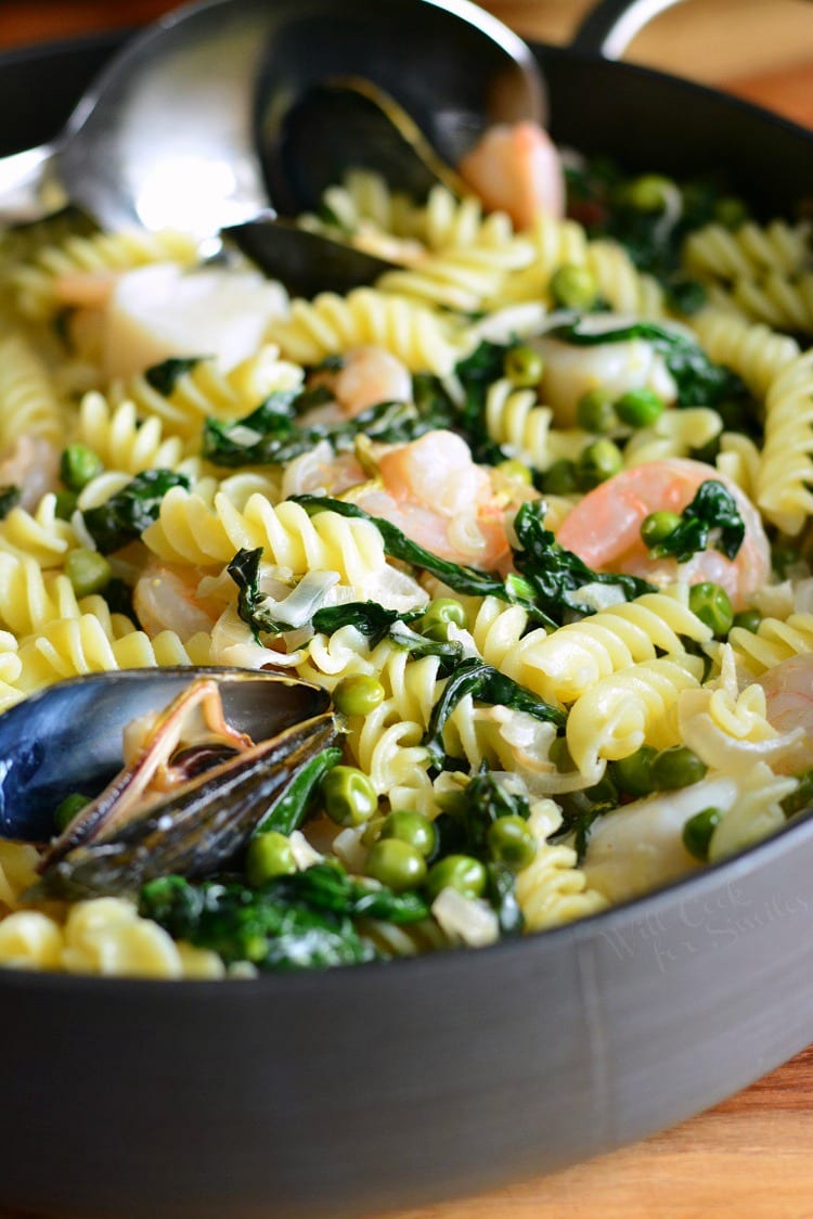 Creamy Spinach and Peas Seafood Pasta in a pan 