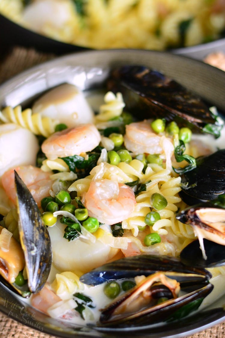 Creamy Spinach and Peas Seafood Pasta in a pan 