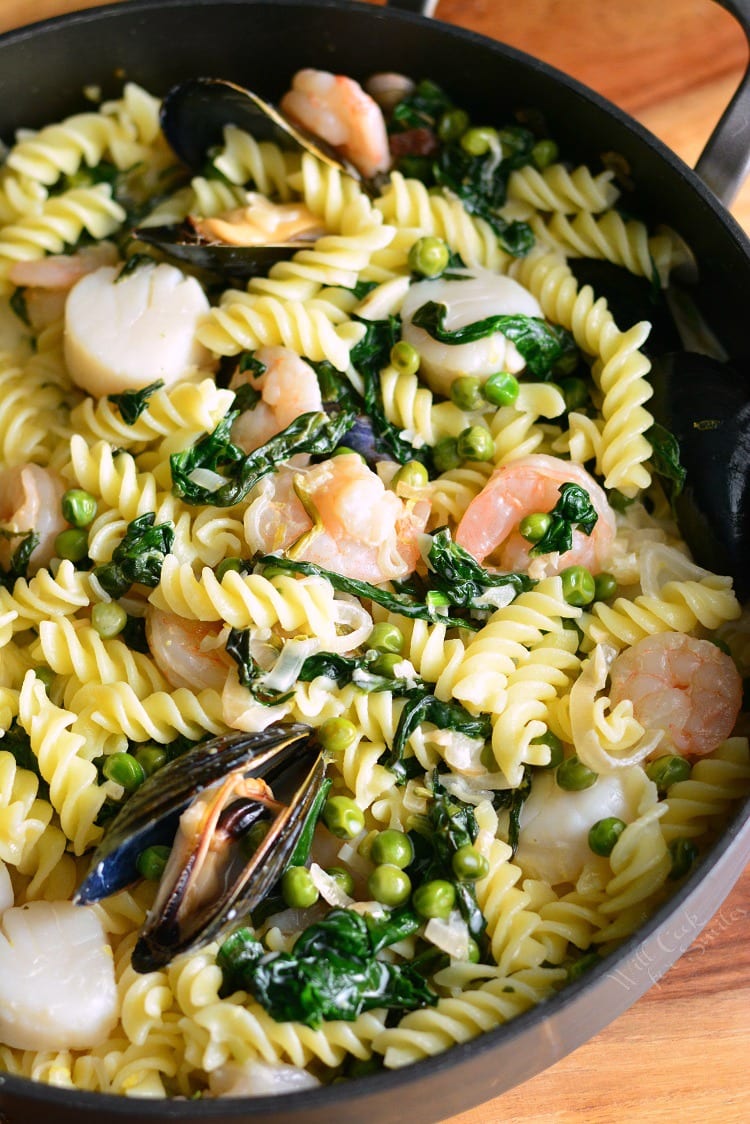 Creamy Spinach and Peas Seafood Pasta in a pan 