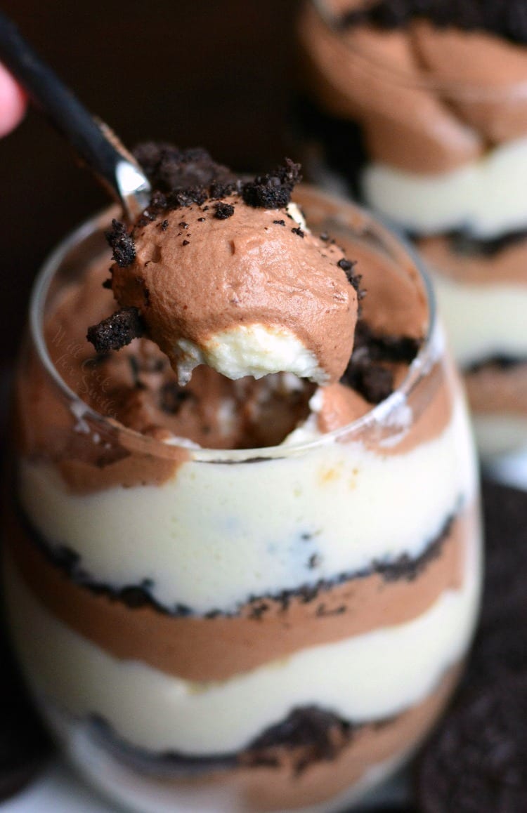 Oreo Double Chocolate Mousse Parfaits in a glass with a spoon scooping some out 
