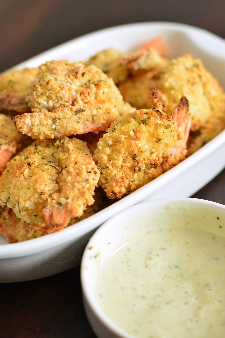 Oven Baked Crispy Parmesan Garlic Shrimp on a serving platter with a bowl of ranch 