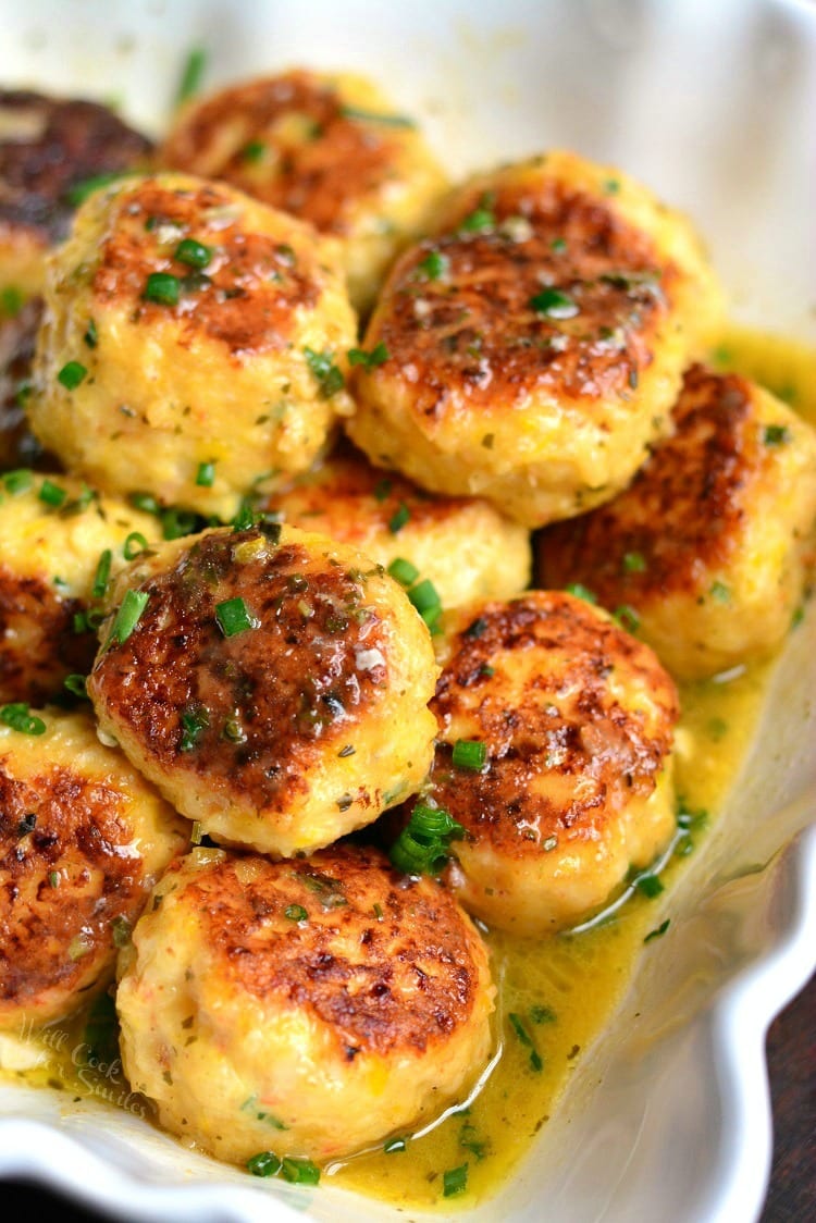a mount of shrimp scampi meatballs in sauce in a serving bowl. 