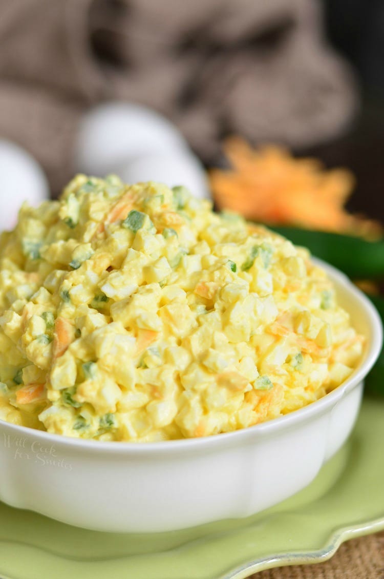 creamy jalapeno cheddar egg salad mounted high in a bowl.