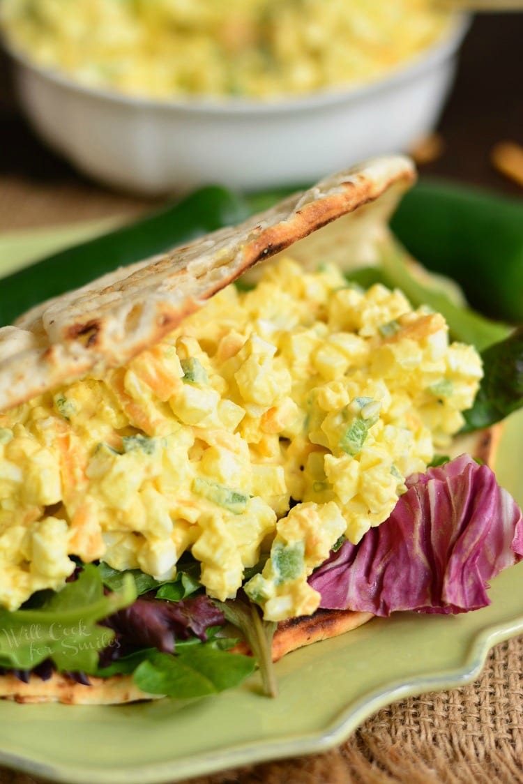 creamy jalapeno egg salad with sharp cheddar cheese in a flatbread.