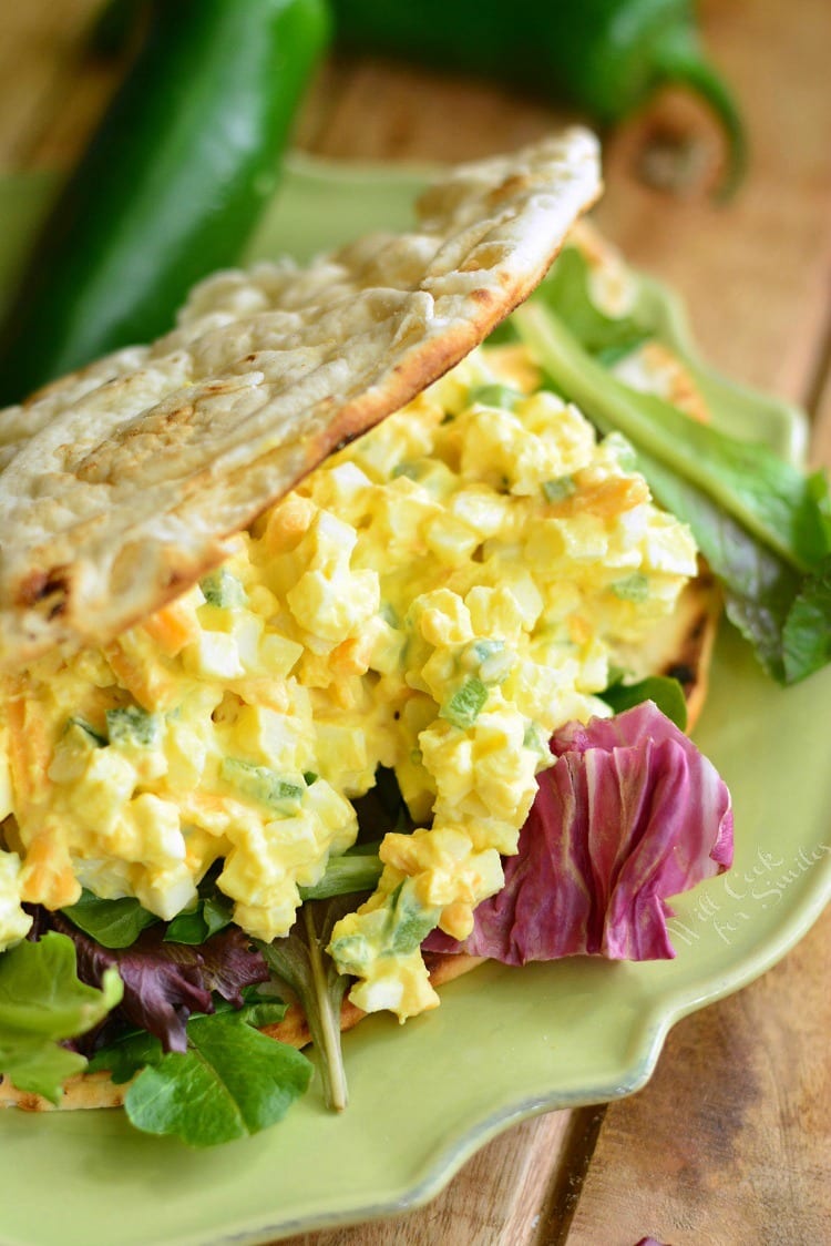 Jalapeno Cheddar Egg Salad in a pita on a plate 