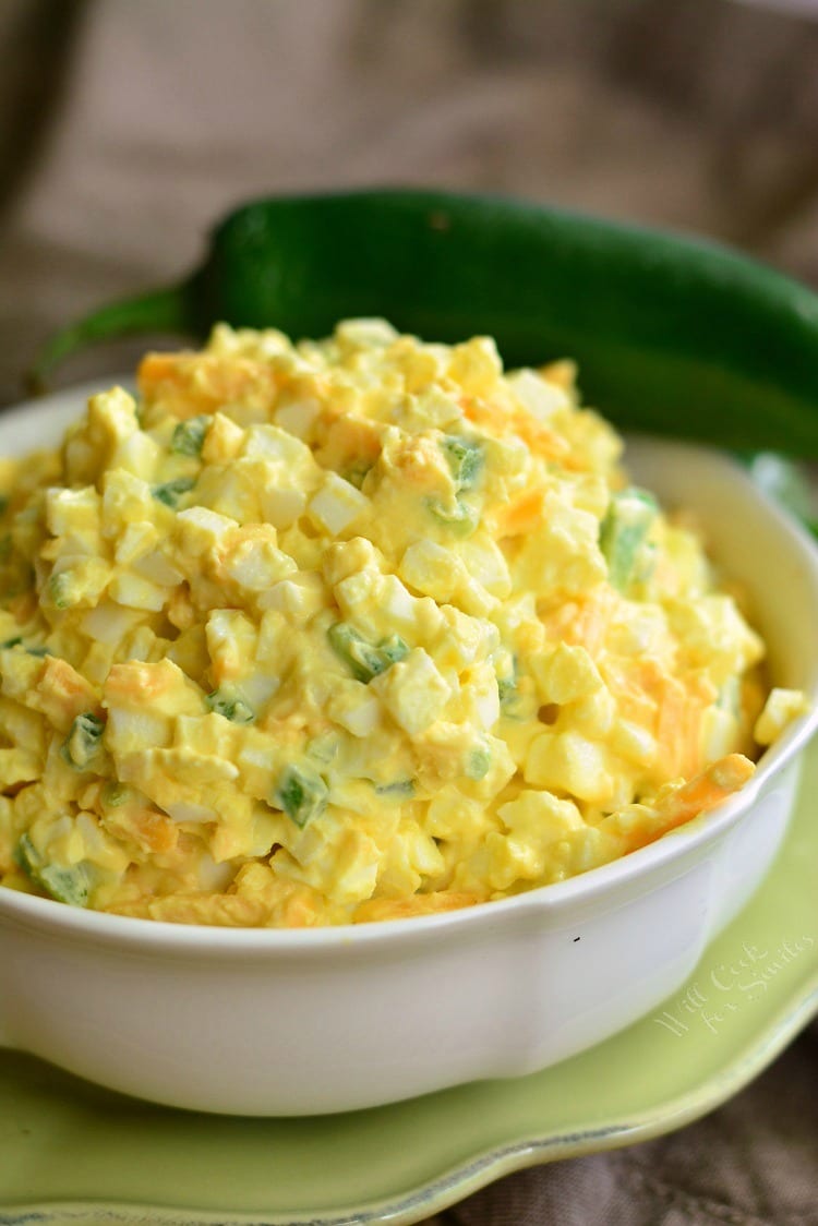 Jalapeno Cheddar Egg Salad in a bowl that's on a plate 