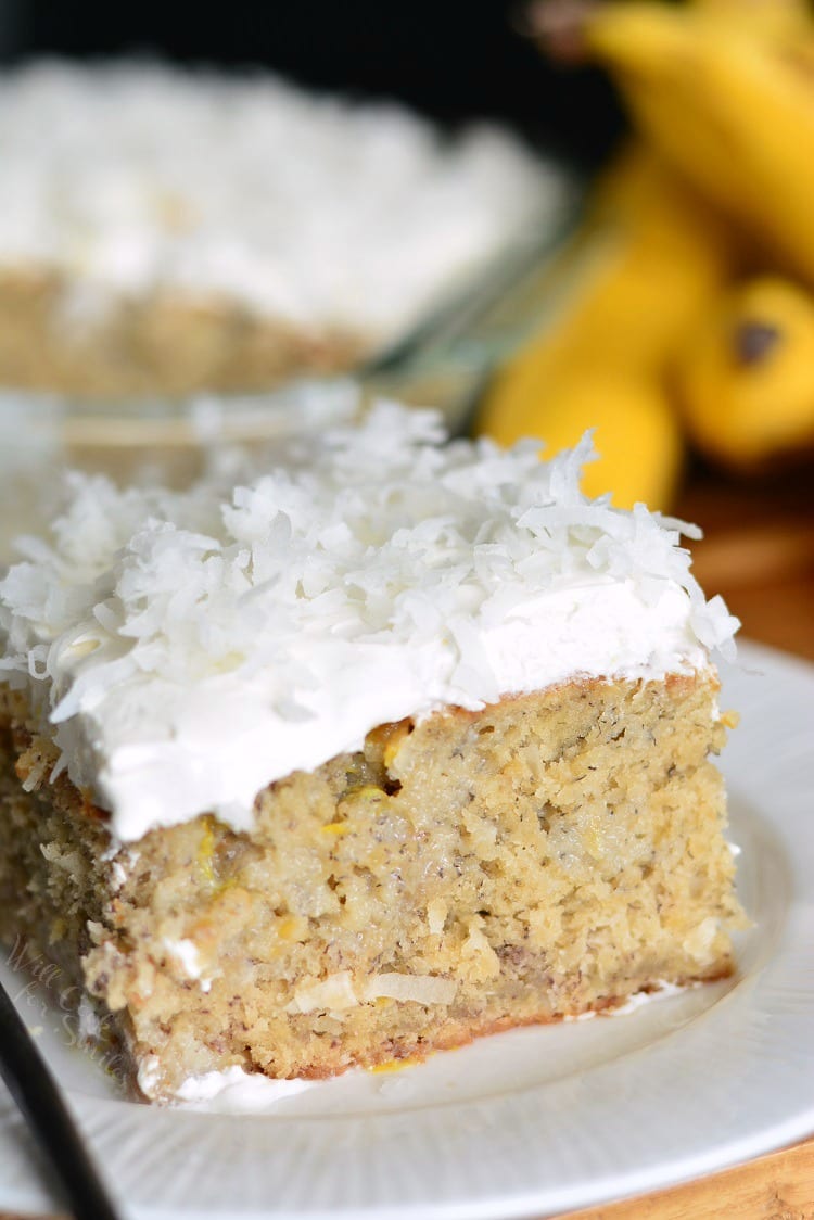 Lemon Coconut Banana Poke Cake on a plate 