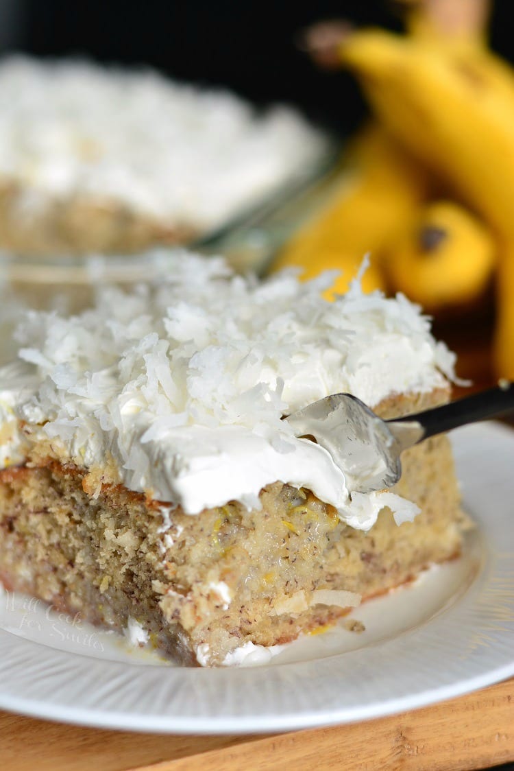 Lemon Coconut Banana Poke Cake with a fork 