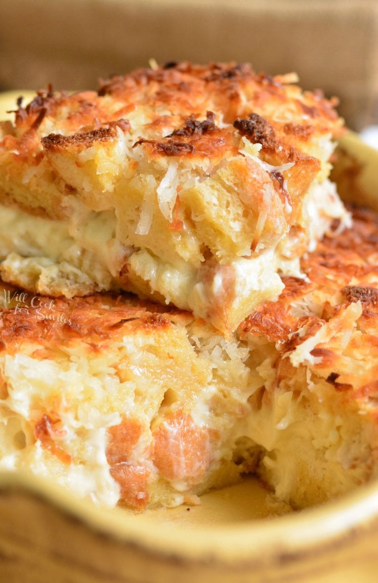 Coconut Cheesecake Bread Pudding in a yellow baking dish 