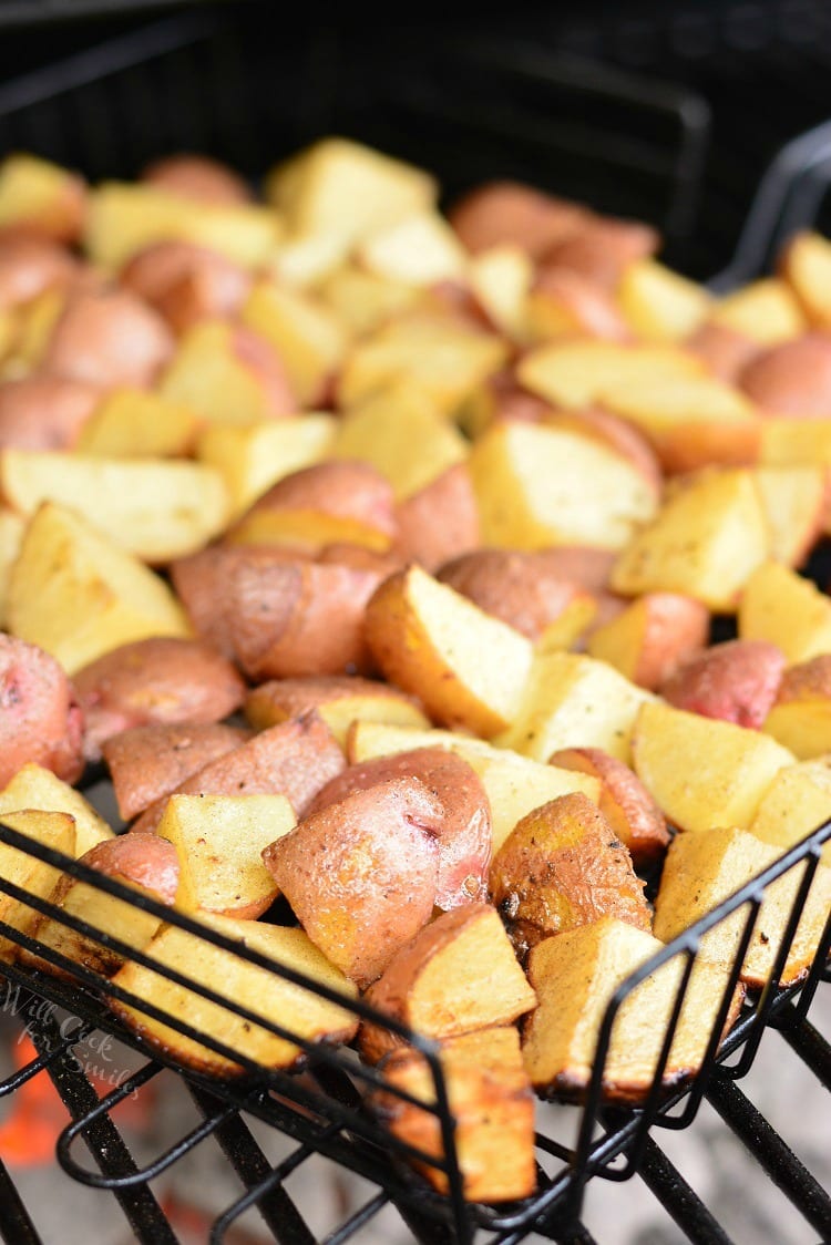 Roasted Garlic Potatoes in a grilling basket on the grill 