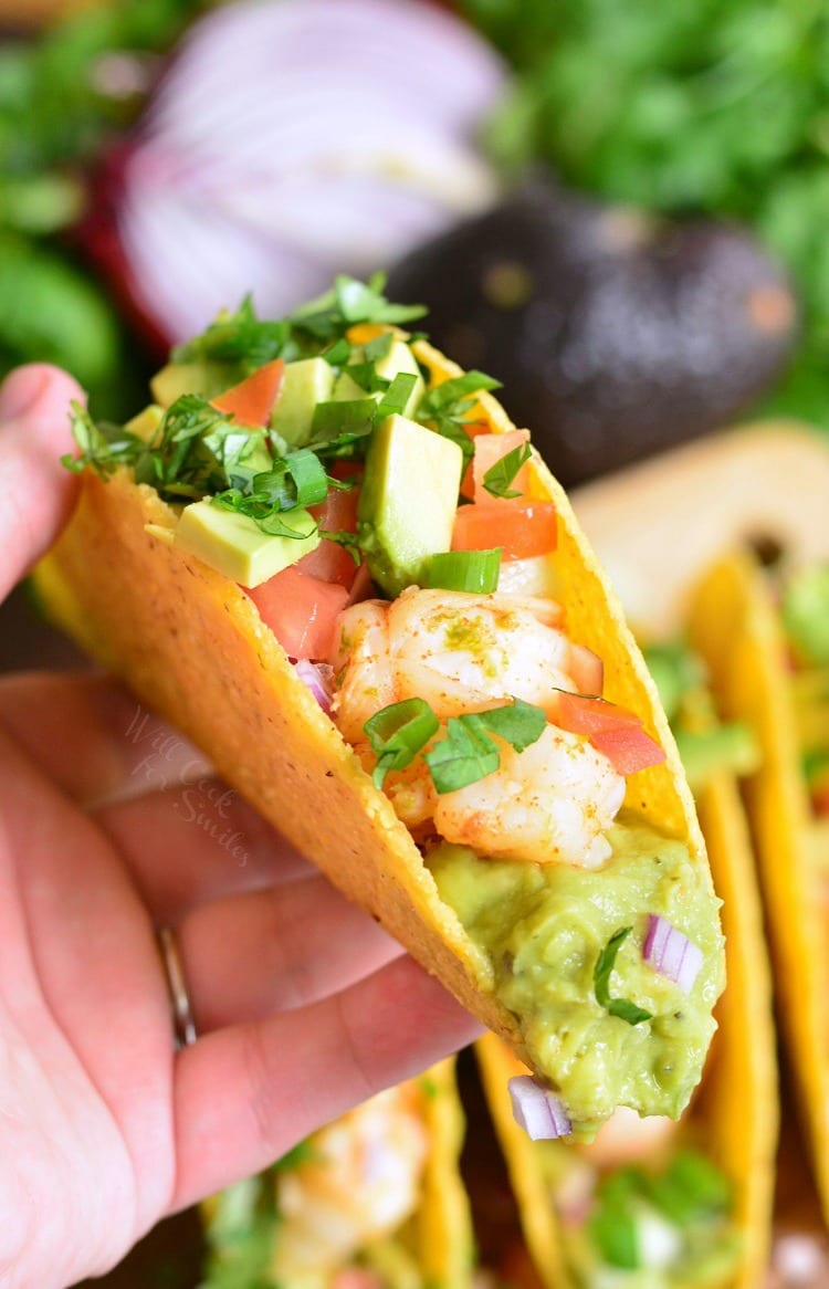 Holding hard shelled shrimp taco in my hand.