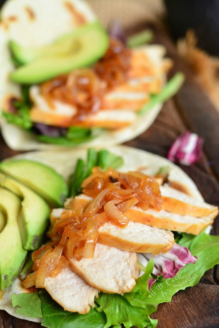 Sweet and Spicy Tequila Chicken Tacos on a wood cutting board 