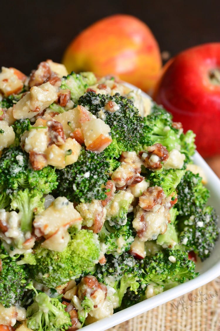 Pear Apple Broccoli Salad in a bowl with apples in the background 