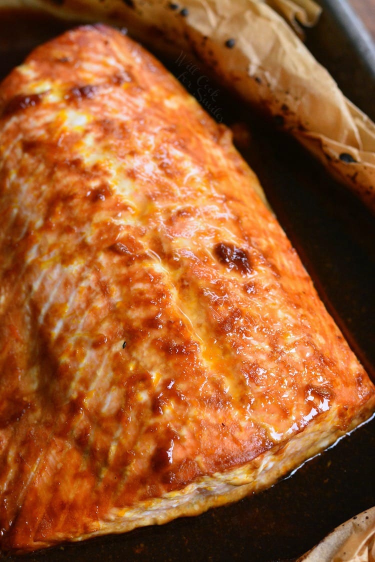 4-Ingredient Orange Salmon in butcher paper on a baking sheet 