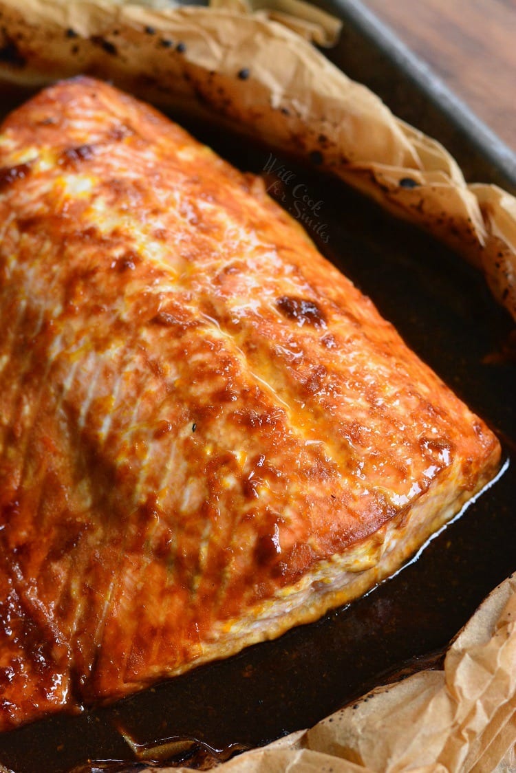 4-Ingredient Orange Salmon in butcher paper on a baking sheet 