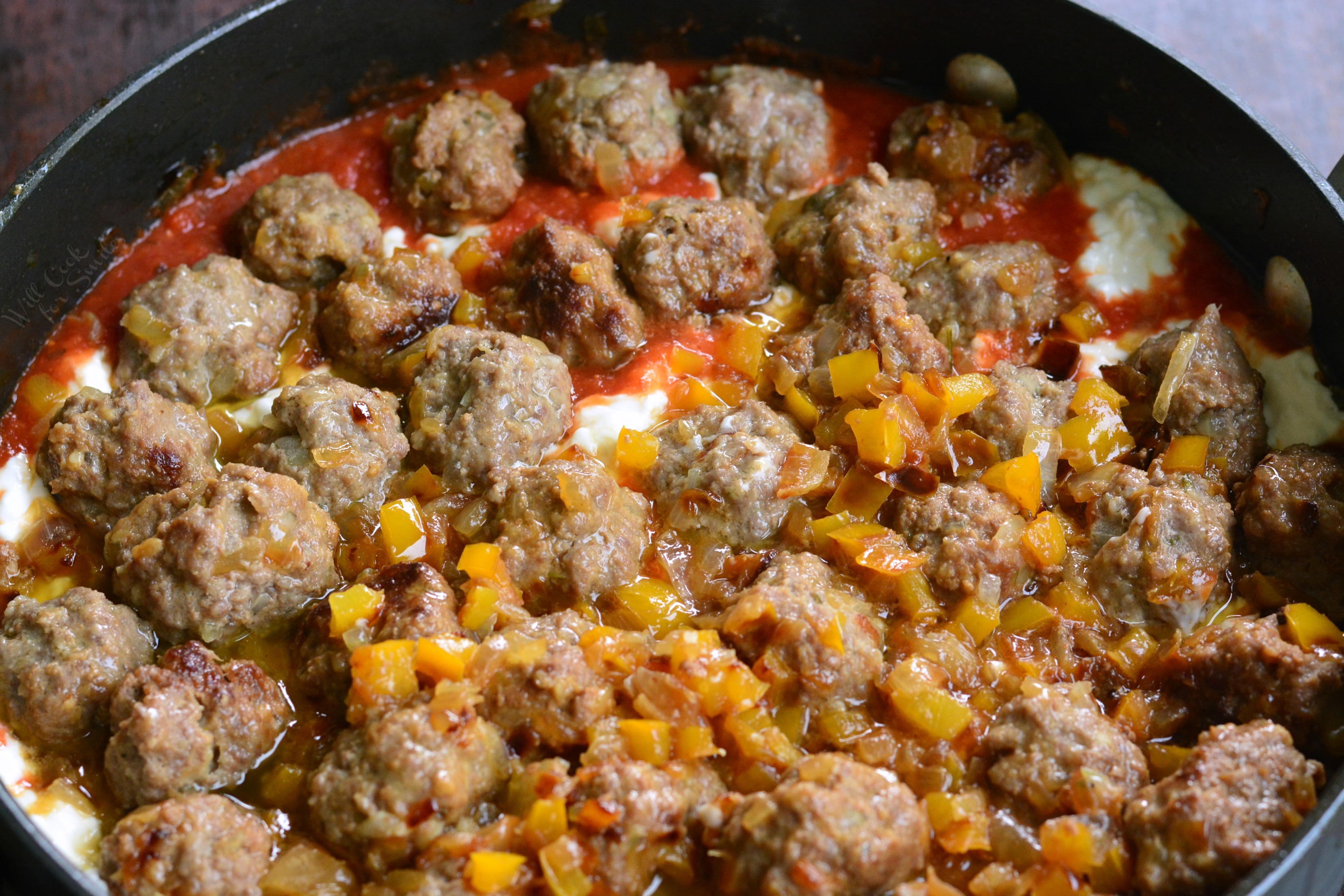 cooking all the ingredients in a pan 