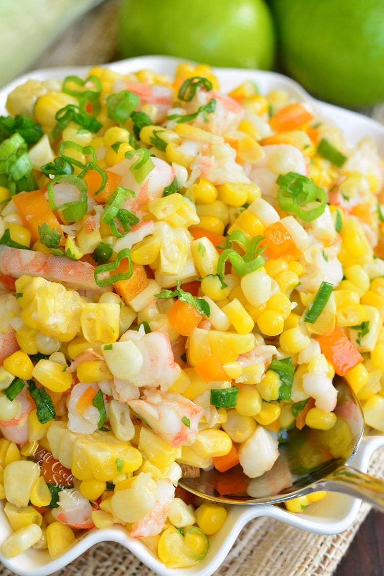 Cilantro Lime Shrimp Corn Salad in a serving bowl with a metal spoon 