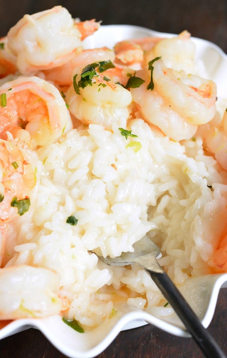 Key Lime Coconut Shrimp and Coconut Rice in a serving bowl with a fork 