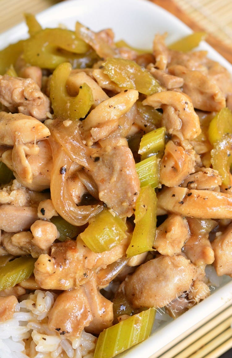 Copycat Pepper Chicken and Rice recipe. Once you try this homemade version of Panda Express Pepper Chicken, you'll never go back to take-out. Juicy, tender chicken thigh meat is sauteed with onions and celery and cooked in black pepper soy sauce. Easy and delicious 30-minutes dinner. #chicken #chickenthighs #rice #chickenandrice #easydinner