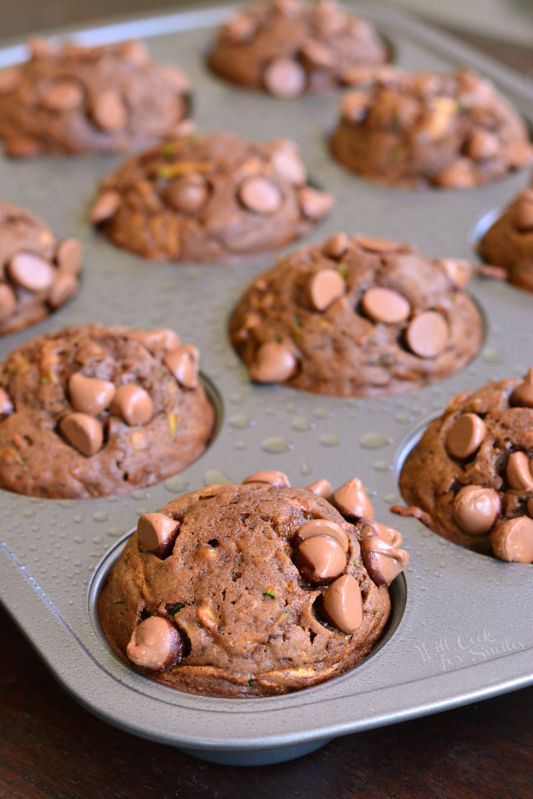 Chocolate Zucchini Muffins in a muffin pan 