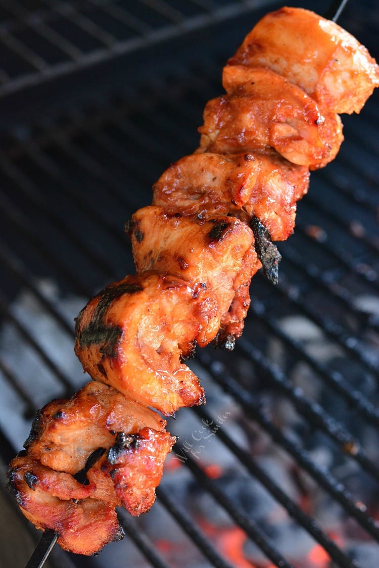 Grilled Spicy BBQ Chicken Skewers on the grill 