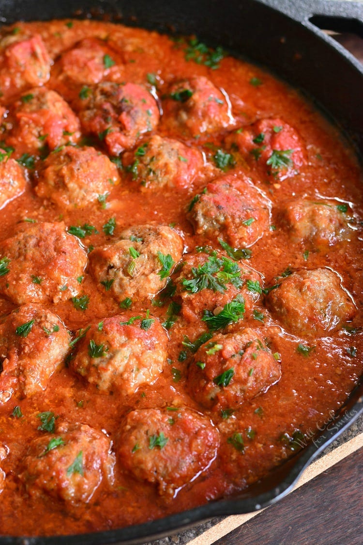 meatballs with marinara sauce in a cast iron skillet 